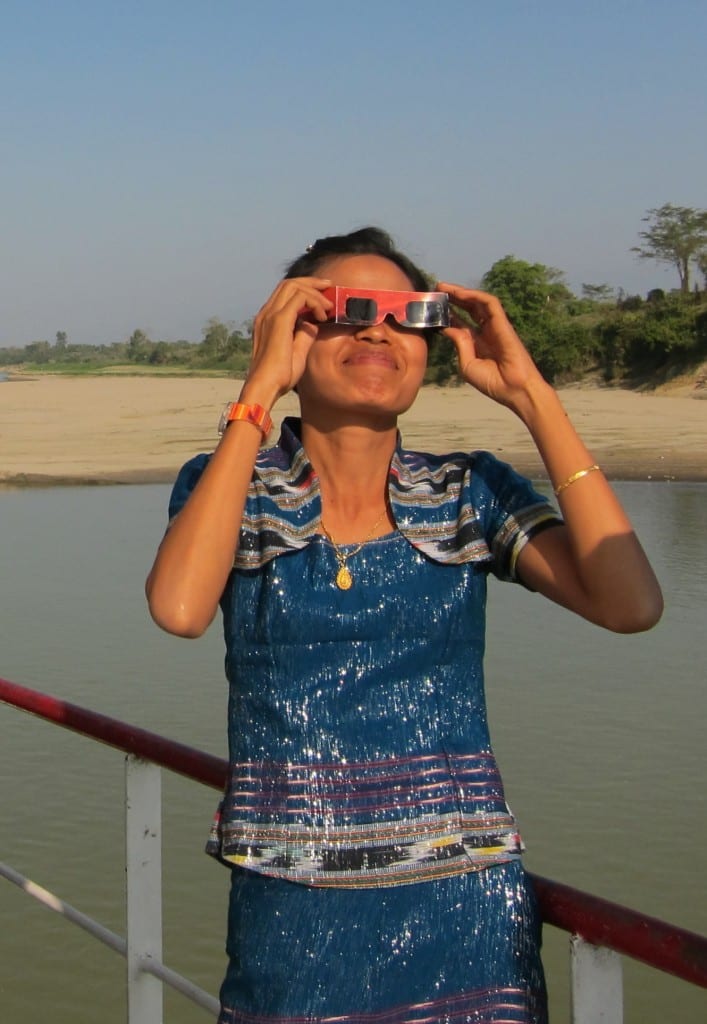 Burmese woman watching the solar eclipse Burmese woman watching the solar eclipse