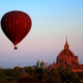 Balloon rising over Htilminlo Paho at dawn in Bagan, Myanmar