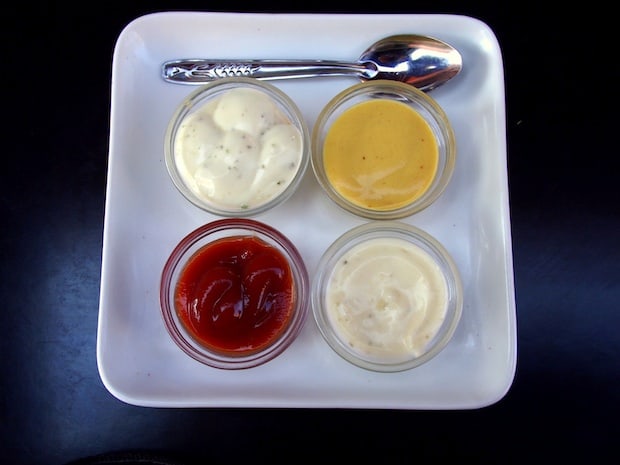 Table condiments at a street stall in Marrakesh, Morocco