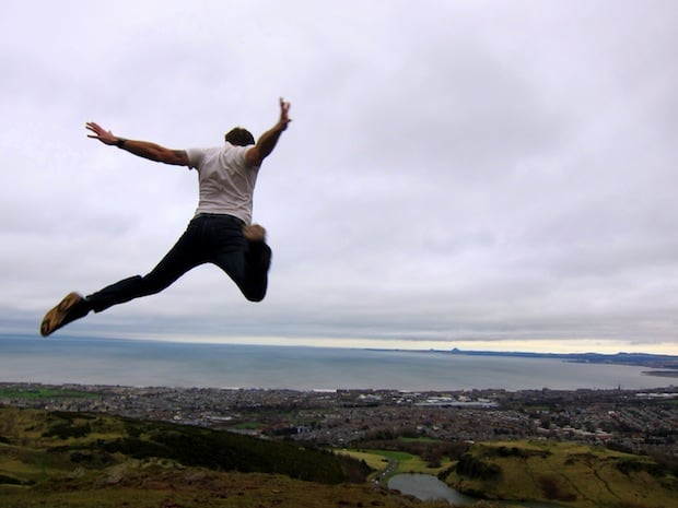 Epic jumping shot over Arthur's Seat, Edinburgh