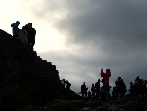 Windy photo-taking atop Arthur's Seat